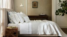 Bedding sales at Matouk: Essex Linen on a bed.