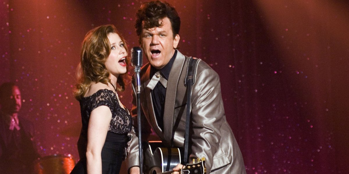 Walk Hard: The Dewey Cox Story Jenna Fischer and John C. Reilly singing at a show