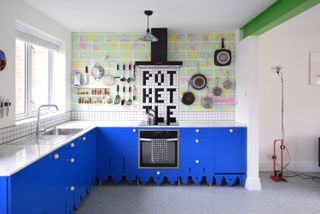 a colorful kitchen with a green beam