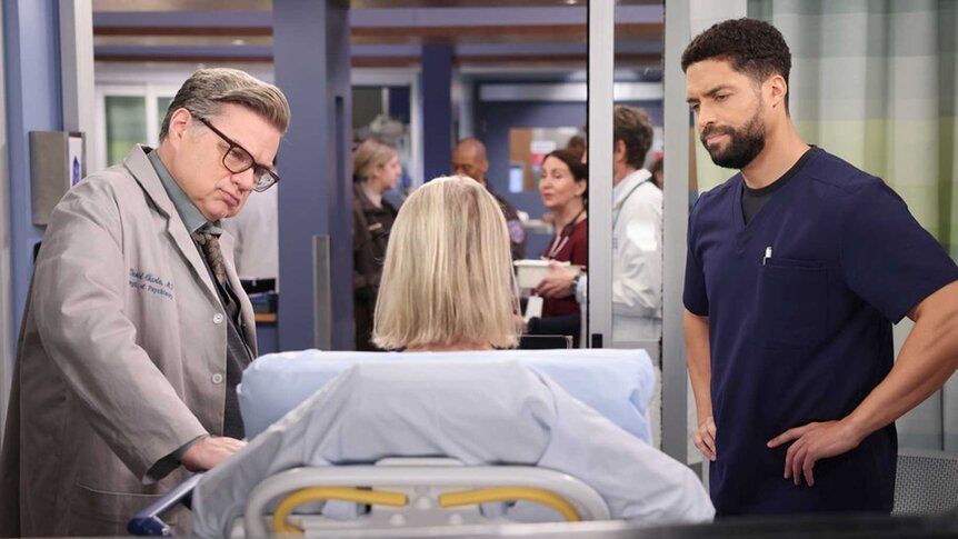 Dr. Daniel Charles (Oliver Platt) and Dr. Loren Johnson (Henderson Wade) examine a patient in Chicago Med