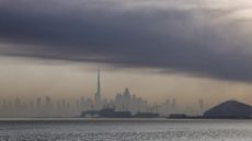 Smoke rises above the Dubai skyline following Iranian missile and drone attacks.