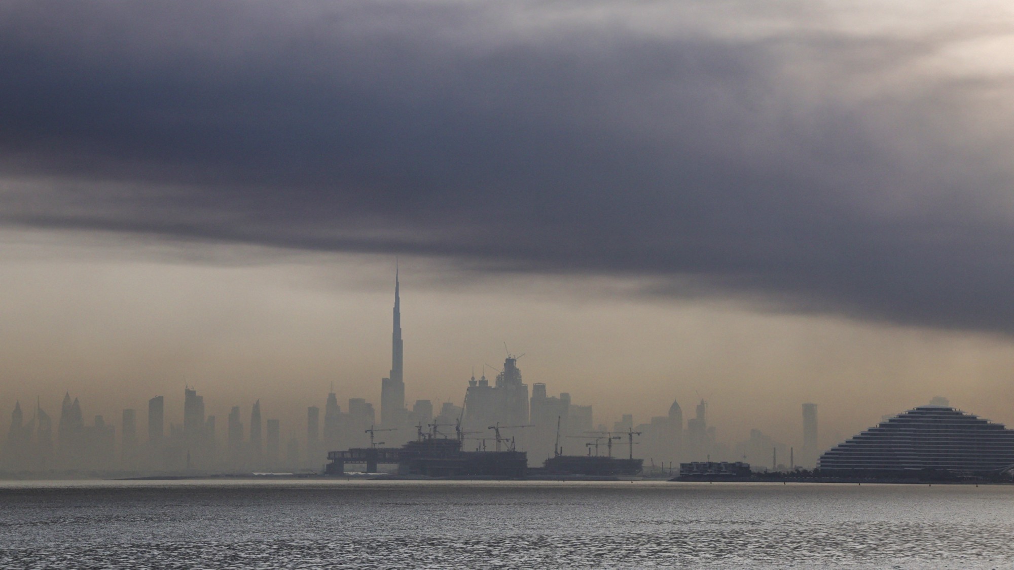 Smoke rises above the Dubai skyline following Iranian missile and drone attacks.
