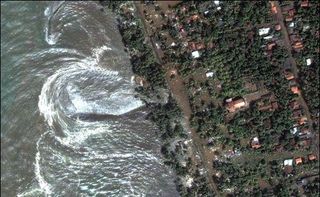 In this shot, water rushes ashore in Sri Lanka during the Indian Ocean tsunami of 2004. The tsunami killed more than 220,000 people around the world and prompted U.S. officials to focus on tsunami preparedness closer to home.