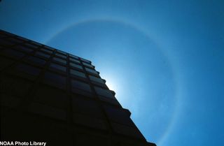 Sun with a 22-degree solar halo arc shining around it