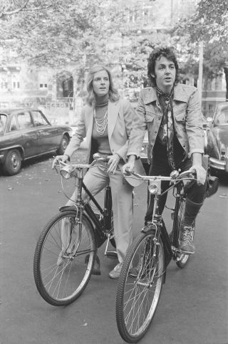 Paul and Linda McCartney on bikes
