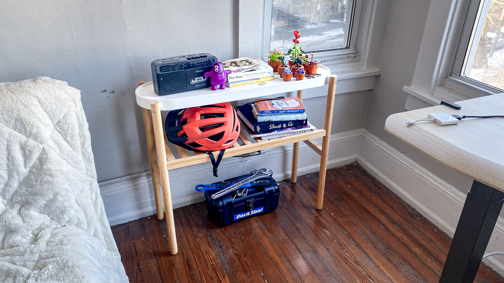 a shelf holding keepsakes and cycling equipment