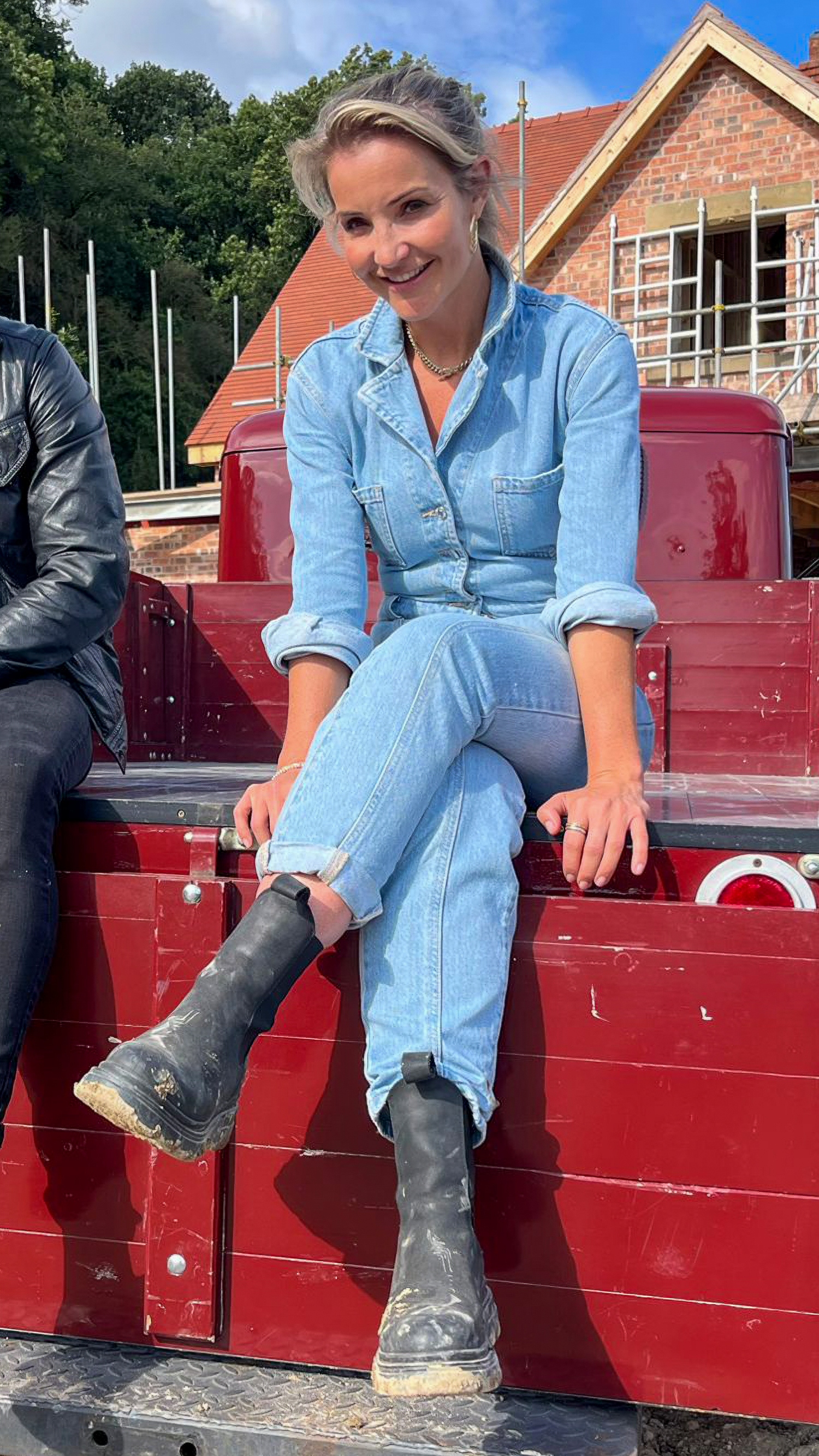 Helen Skelton sits on the back of a truck in the series Forever Home