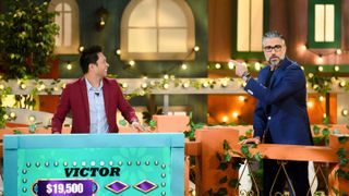 Jaime Camil and a contestant on Loteria Loca
