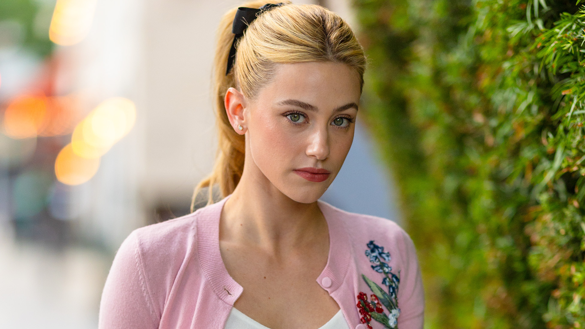 Lili Reinhart started her 'Love Hypothesis' press tour in the perfect pink cardigan for fall