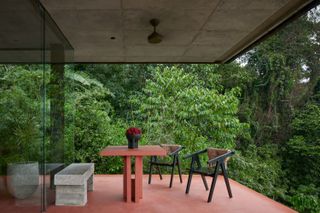 Outdoor deck with chairs at one of two Costa Rican retreats