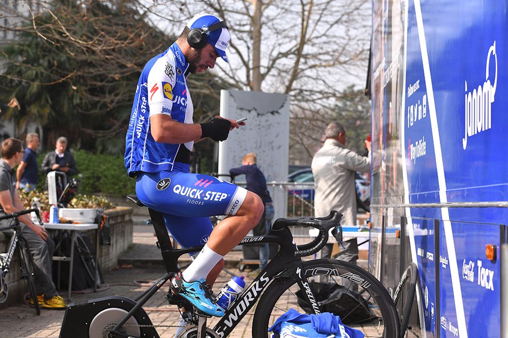 Fernando Gaviria (Quick-Step floors) catches up with electronics while riding his trainer.