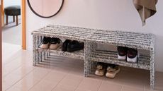 Shoes lined up on an entryway storage rack