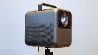 An Anker Nebula X1 laser projector on a stand