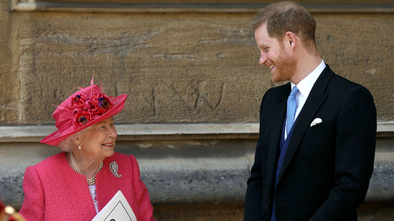 Queen Elizabeth II speaks with Prince Harry, Duke of Sussex as they leave after the wedding of Lady Gabriella Windsor to Thomas Kingston at St George&#039;s Chapel, Windsor Castle 