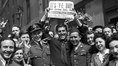 Crowd celebrates VE Day, London 1945.