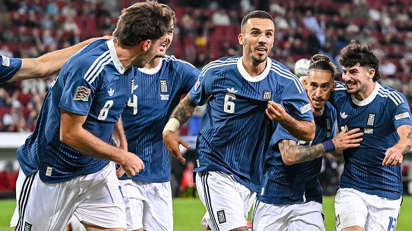 Dimitris Kourbelis of Greece celebrates after scoring his team's first goal with teammates during the UEFA Nations League 2026/27 group phase match between Germany and Greece.