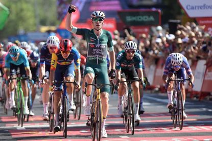 Team Visma's Wout van Aert celebrates winning the stage 7 of La Vuelta a Espana cycling tour, a 180.5 km race between Archidona and Cordoba, on August 23, 2024. (Photo by CRISTINA QUICLER / AFP)