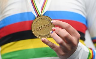 A rainbow jersey and gold medal from Road Worlds