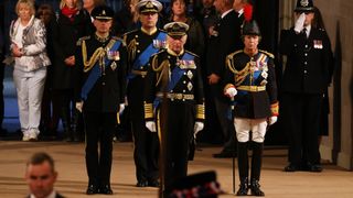 Prince Edward, Prince Andrew, King Charles and Princess Anne standing in a Vigil of the Princes