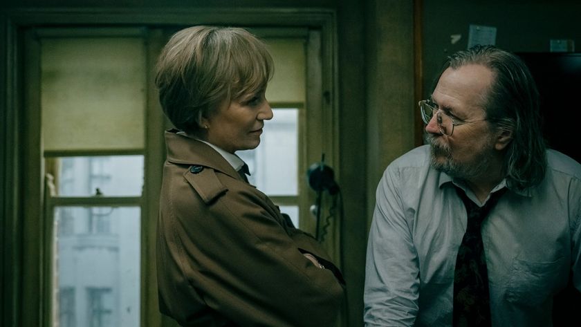 MI5 deputy director Diana Taverner (Kristin Scott Thomas) delivers some unwelcome news to unkempt agent Jackson Lamb in the dingy office interior of Slough House in Slow Horses season 5.
