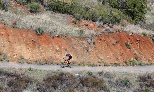A lone rider leads up the four mile road climb
