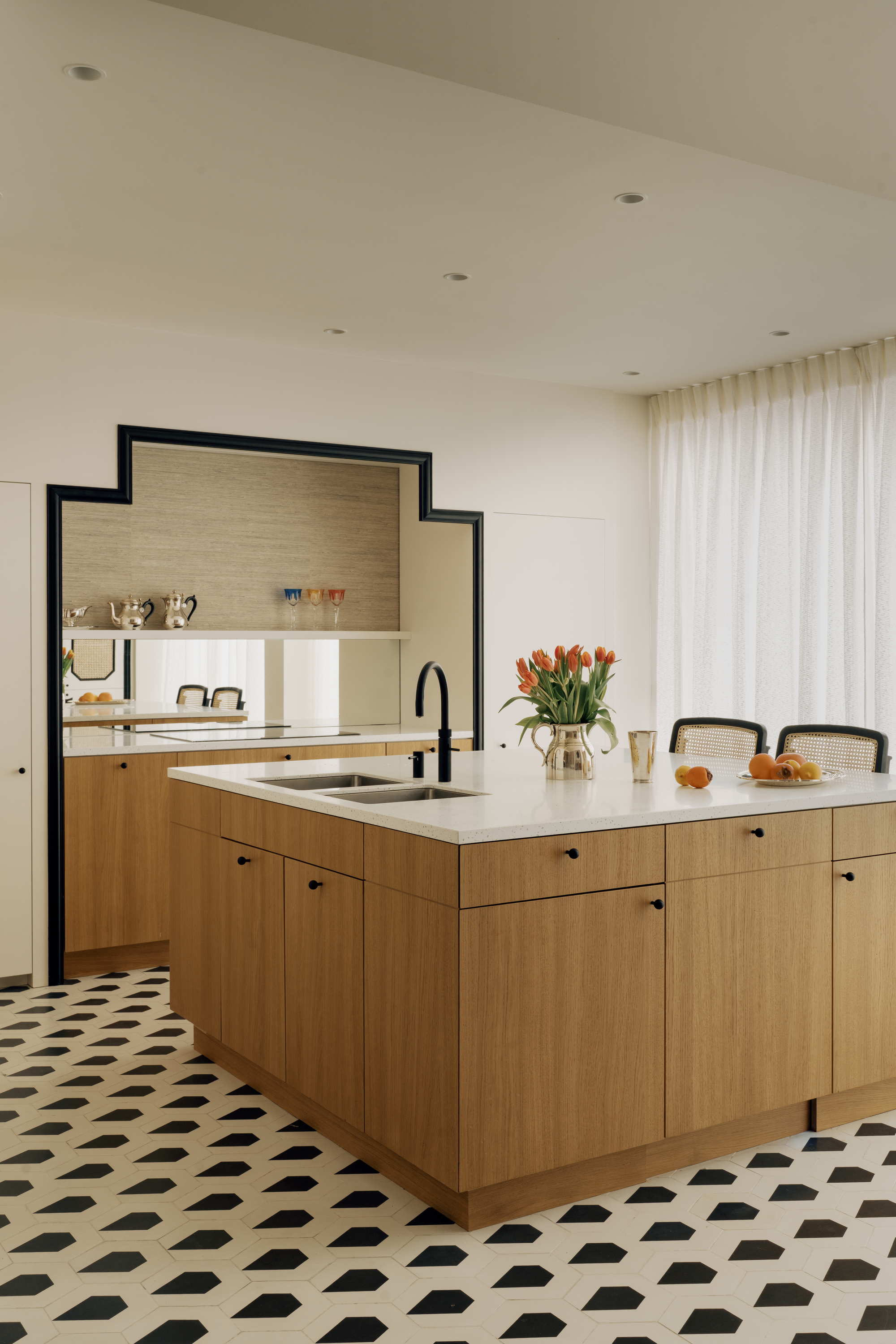 black cut out mirror kitchen island geometric tile floor