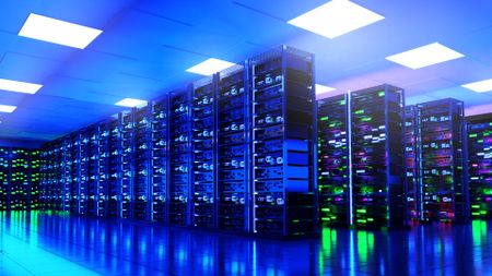 A data center with racks of servers and lots of lights glowing