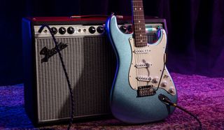 A Fender Strat, set against a Fender amplifier