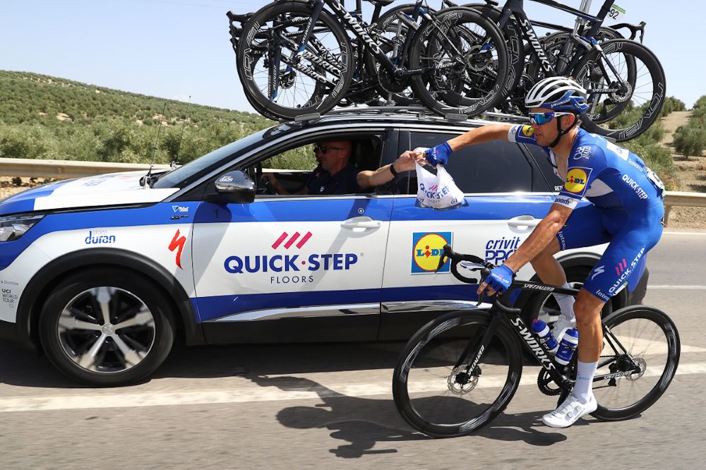 A Quick-Step rider gets refreshments during stage 8 at the Vuelta