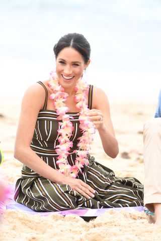Meghan, Duchess of Sussex talks to members of OneWave, an awareness group for mental health and wellbeing at South Bondi Beach on October 19, 2018 in Sydney, Australia. The Duke and Duchess of Sussex are on their official 16-day Autumn tour visiting cities in Australia, Fiji, Tonga and New Zealand