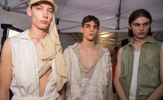 Cottweiler S/S 2018 models backstage wearing whites and olive green attire