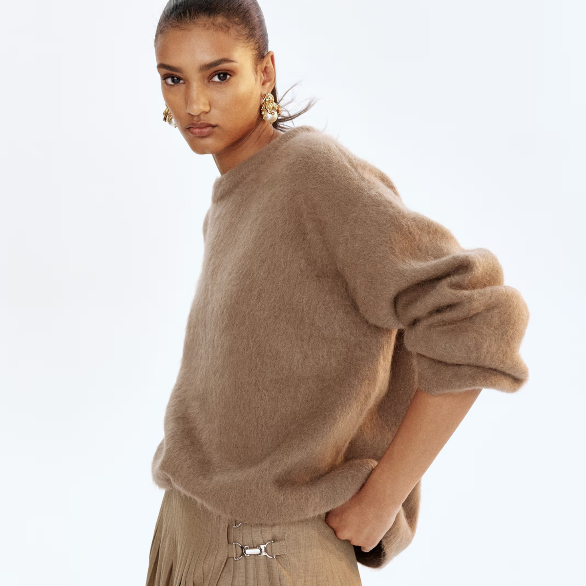 Model wearing a brown jumper