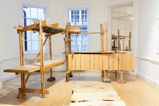 AA show Distillation of Architecture view of exhibition showing timber structures