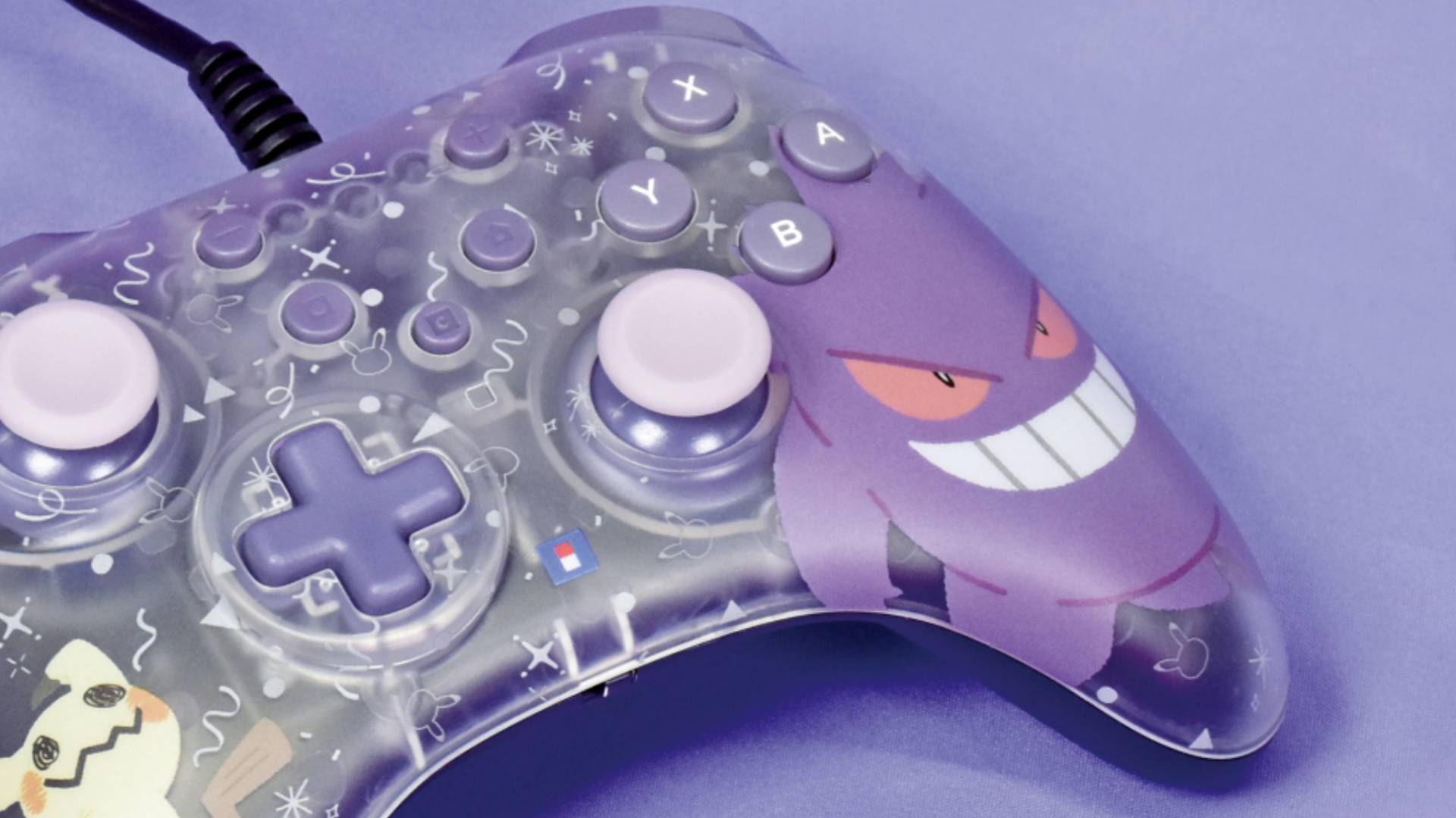 Official marketing image showing art of Gengar on the right grip of a wired Switch 2 controller.