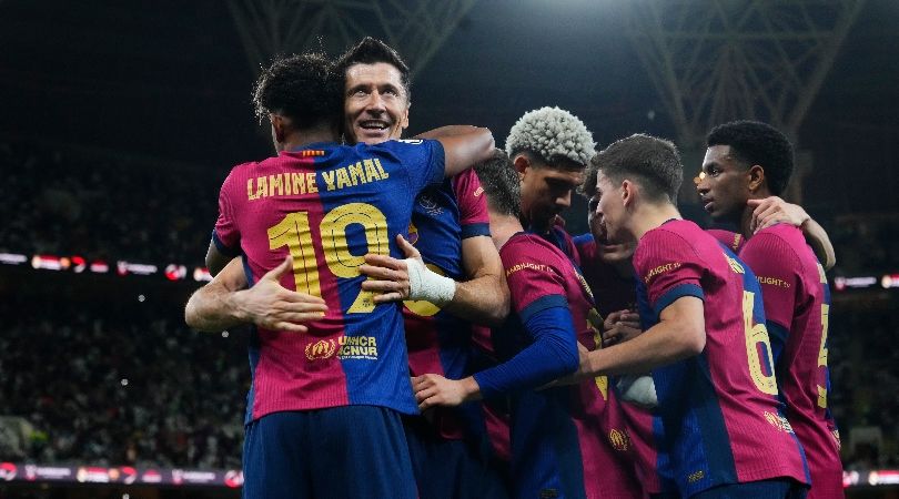 Barcelona players celebrate Robert Lewandowski&#039;s goal against Real Madrid in the Supercopa de España in January 2025.