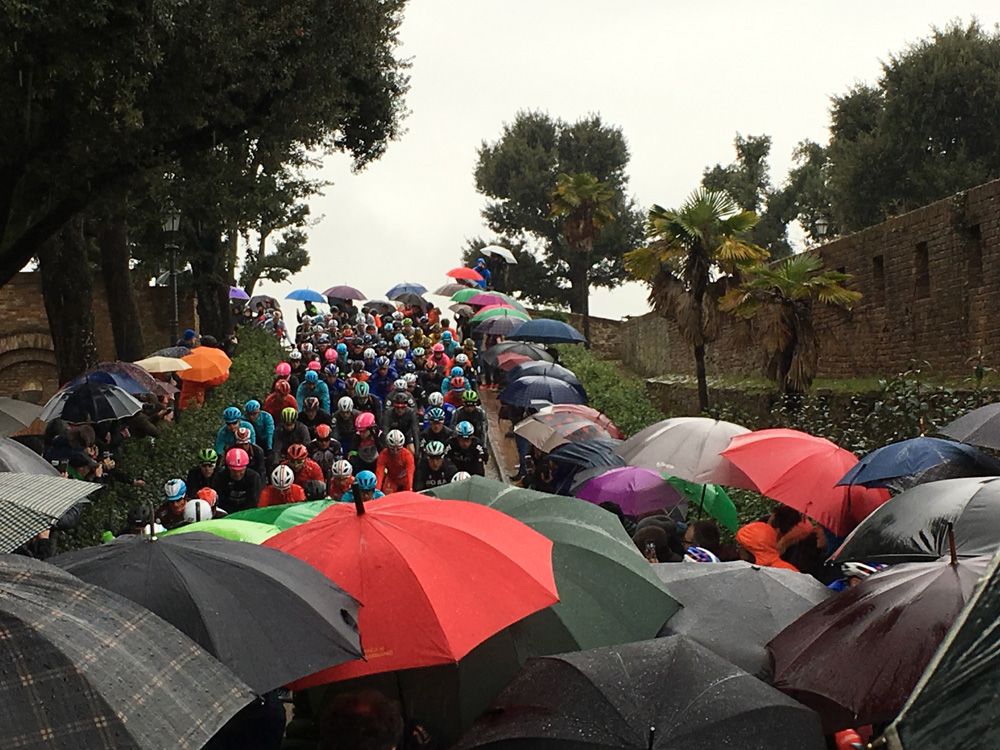 The riders roll out as the rain pours