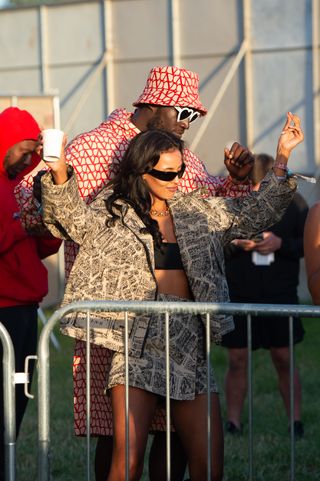 GLASTONBURY, ENGLAND - JUNE 28: Stormzy and Maya Jama watch D-Block Europe perform during day three of Glastonbury Festival 2024 at Worthy Farm, Pilton on June 28, 2024 in Glastonbury, England. Founded by Michael Eavis in 1970, Glastonbury Festival features around 3,000 performances across over 80 stages. Renowned for its vibrant atmosphere and iconic Pyramid Stage, the festival offers a diverse lineup of music and arts, embodying a spirit of community, creativity, and environmental consciousness. (Photo by Joseph Okpako/WireImage)