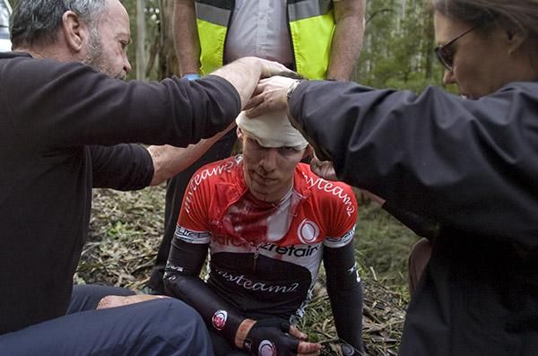 Search2Retain-MyTeam2 rider Alexander Smyth from Victoria receives treatment for a head injury after a nasty fall on day two of the tour.