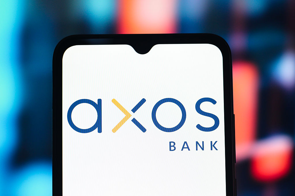 The Axos Bank logo is seen displayed on a smartphone screen.