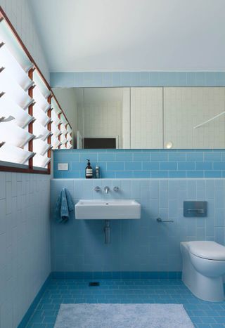 Two-tone blue tiled bathroom