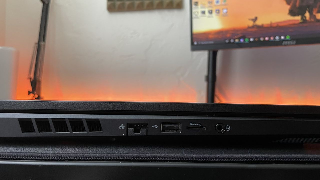 Close-up of the ports on the left edge of the Acer Nitro 17 on a black desk.