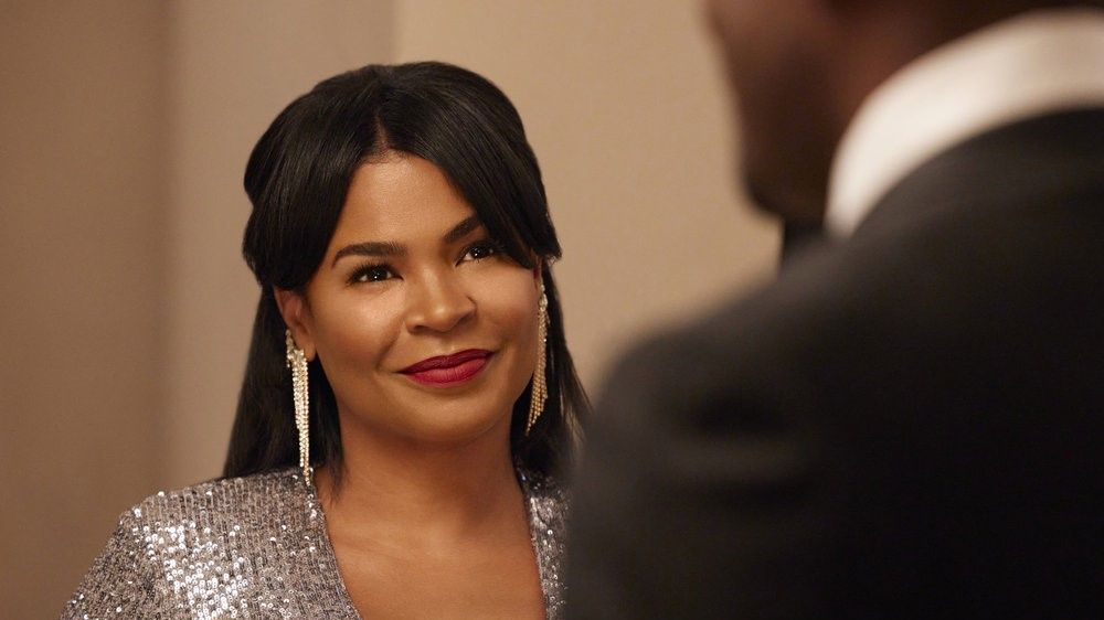 Nia Long as Jordan smirking in The Best Man: The Final Chapters