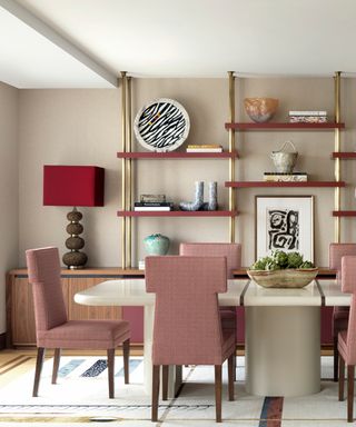 Neutral painted dining room with luxe materials and pink upholstered chairs