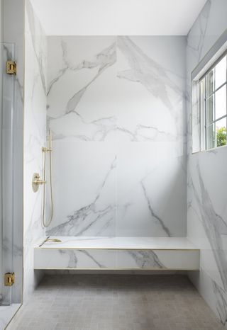 shower room with oversized marble effect wall tiles.