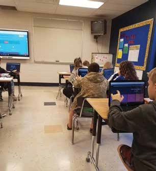 Gilmer County High School students engaged in Quizizz, an online review game.