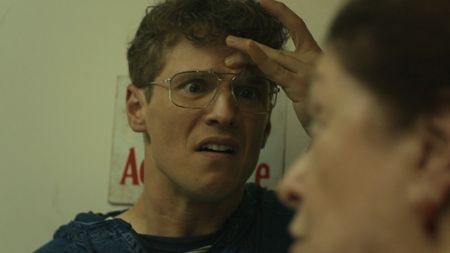 Vigilante looking furious at his mother in Peacemaker Season 2.