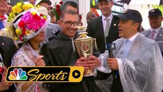 The owners of Justify, the winner of the “Run for the Roses” are awarded the trophy.