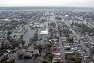 Flooded neighborhoods are visible as the Coast Guard conducts initial Hurricane Katrina damage-assessment overflights on Aug. 29, 2005, in New Orleans.
