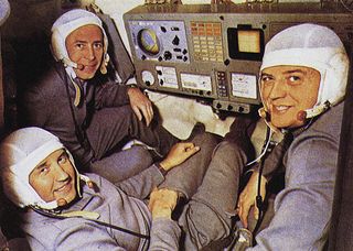 Soyuz 11 cosmonauts Viktor Patsayev, Georgi Dobrovolsky, and Vladislav Volkov are shown in a flight simulator in this photo.
