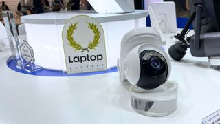 The Reolink Altas PT Ultra on display at IFA Berlin 2024 with a Laptop Laurels award trophy